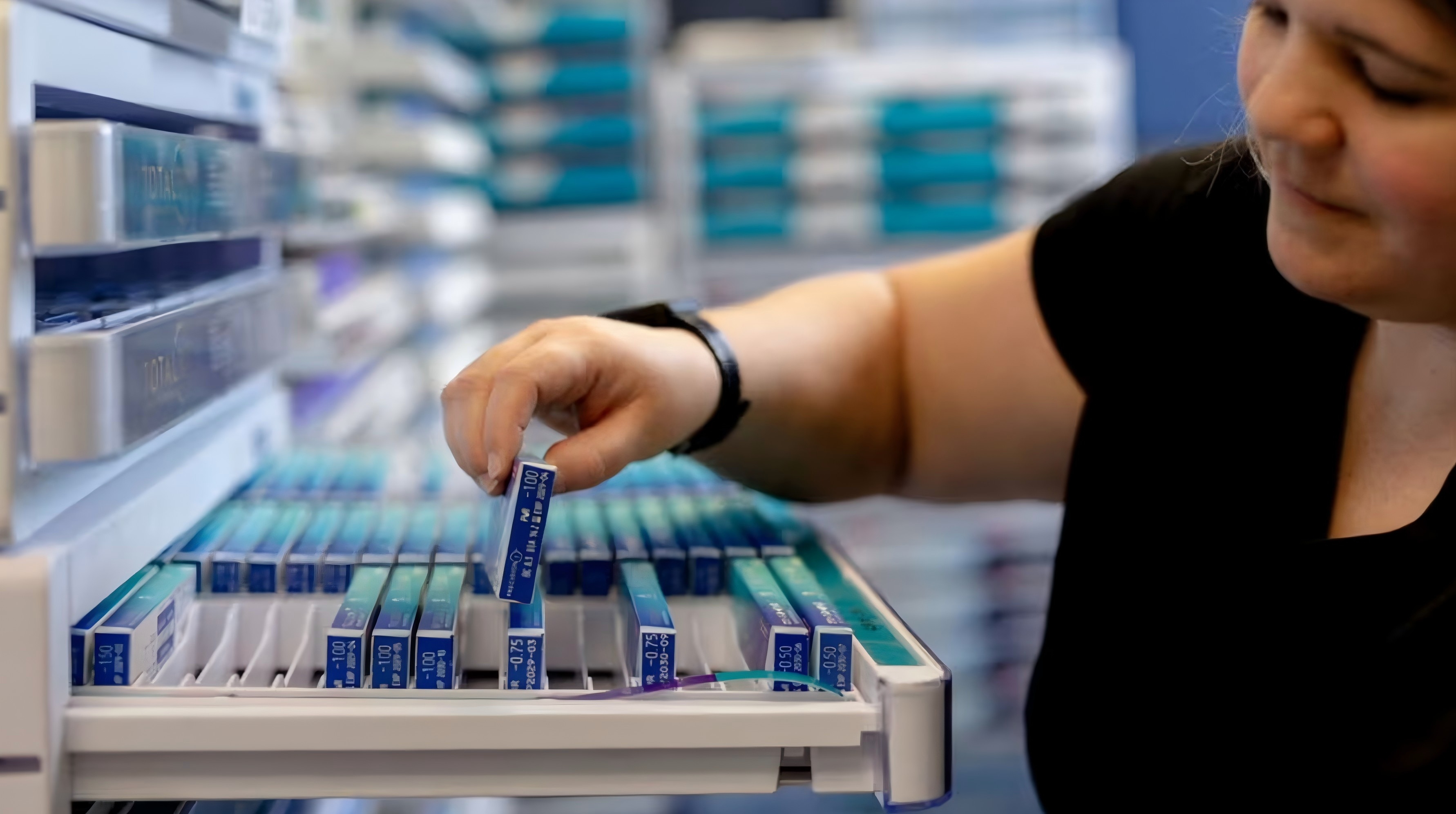 A woman buying contact lenses at store