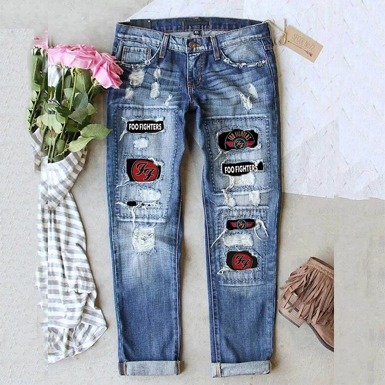 Fashionable retro ripped printed jeans