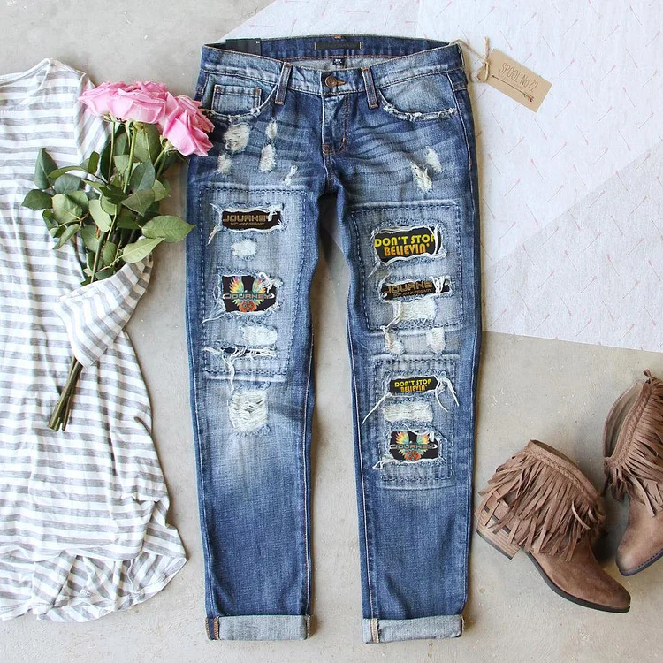 Fashionable retro ripped printed jeans