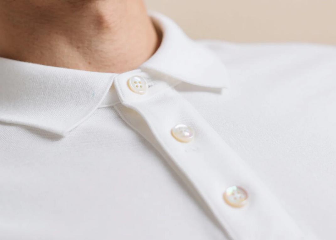 A polo shirt with mother of pearl buttons