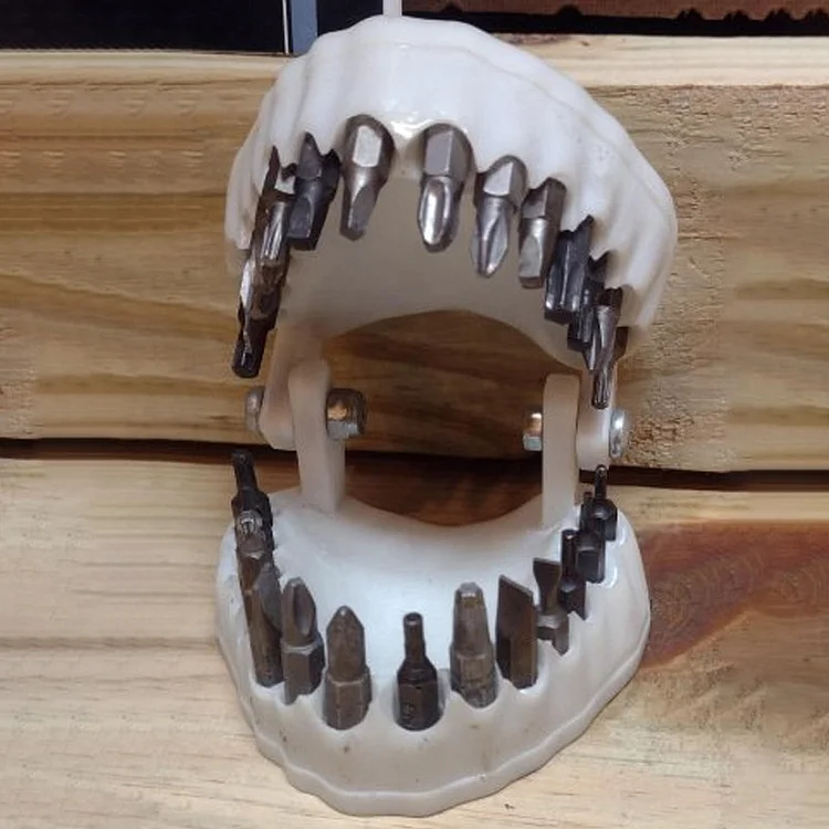 A denture drill bit holder