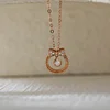 14K Rose Gold Bow Tie Pendant Necklace with Round Lab Dimaond
