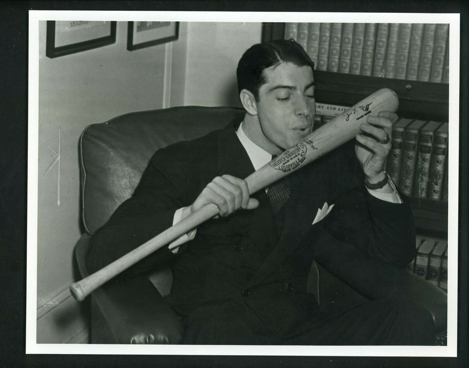 Joe DiMaggio kisses his bat circa 1940's Type IV Press Photo Poster painting Yankees