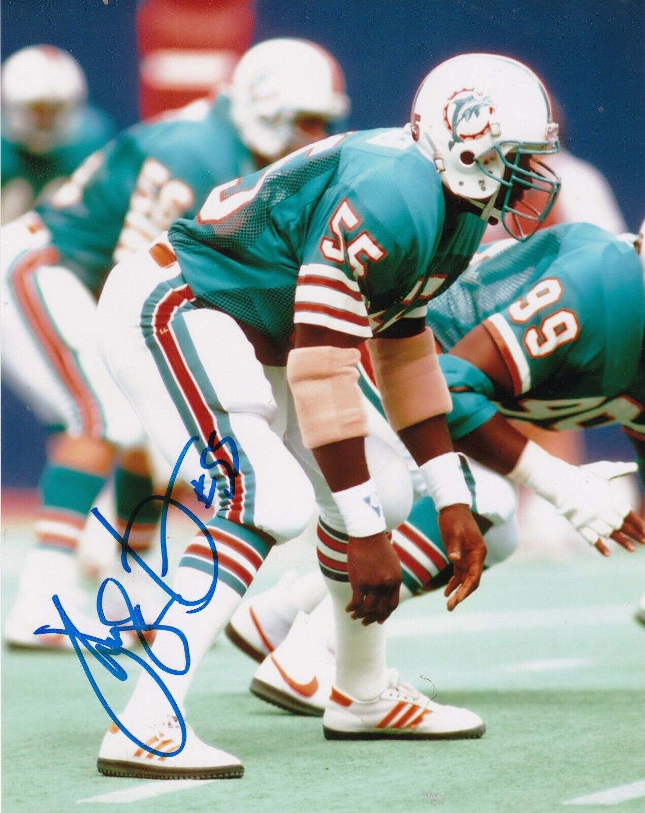 HUGH GREEN MIAMI DOLPHINS ACTION SIGNED 8X10