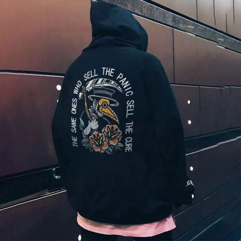 THE SAME ONES WHO SELL THE PANIC SELL THE CURE Graphic Black Print Hoodie