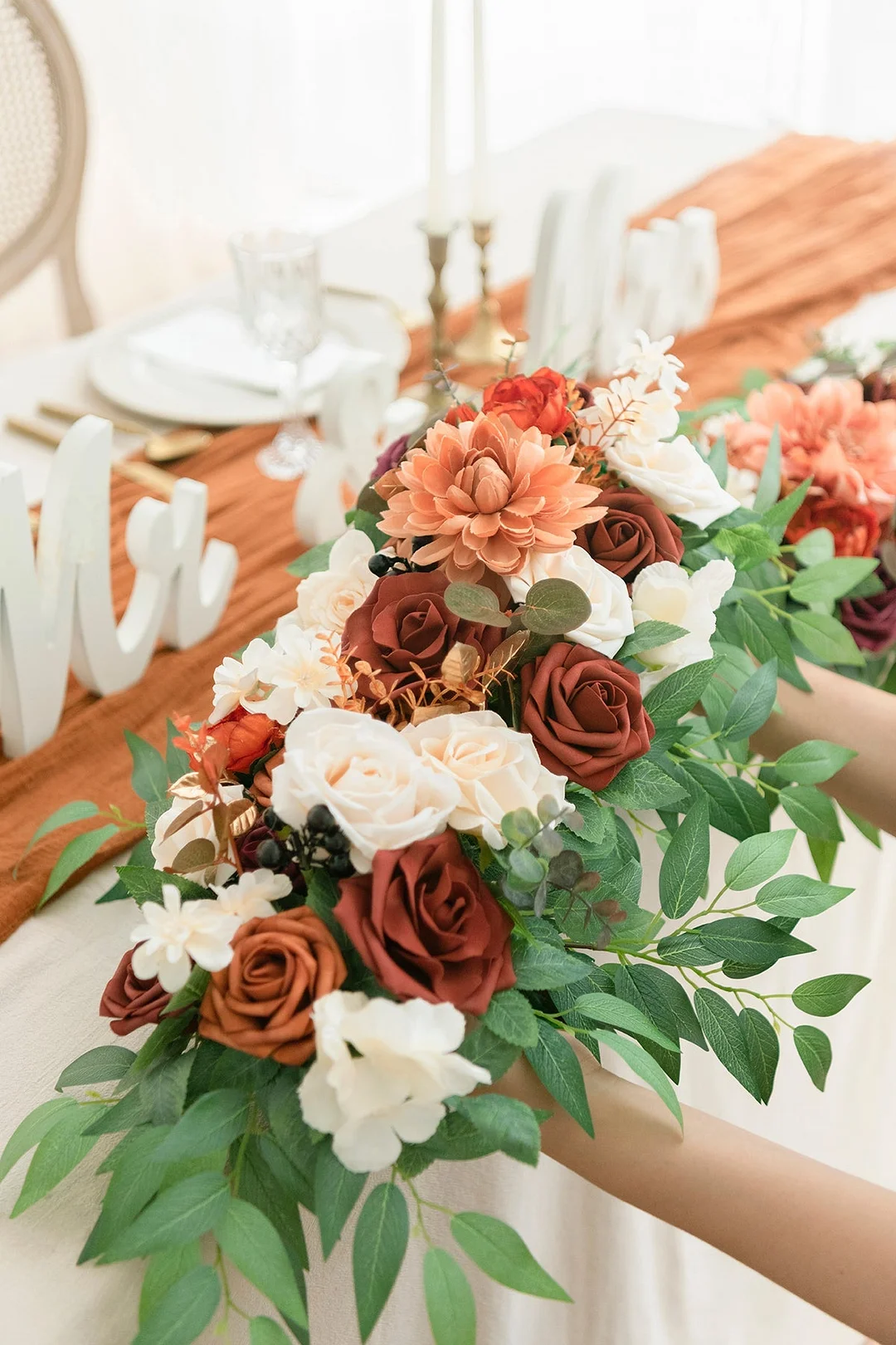 Flower Arrangements for Arch Decor in Sunset Terracotta