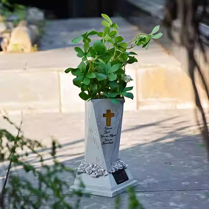 Honor the memory of your beloved companion with our Solar Pet Memorial Vase with Light&mdash;a unique combination of practical flower vase and glowing memorial tribute. Crafted from durable, weather-resistant resin with a beautiful stone-like finish, this versatile piece features an integrated solar-powered LED light that automatically illuminates at dusk, casting a gentle glow through the vase design . Fully customizable with laser engraving, you can personalize it with your pet's name, dates, and a heartfelt message. Perfect as a dog memorial vase or cat memorial vase for garden placement, patio decoration, or indoor display. Whether holding fresh flowers or standing alone as a luminous tribute, this solar memorial brings comfort and beauty to any remembrance space .