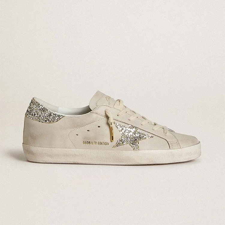 Golden Goose Super-Star Donna LTD de napa marfil con estrella y refuerzo del talón con purpurina platino