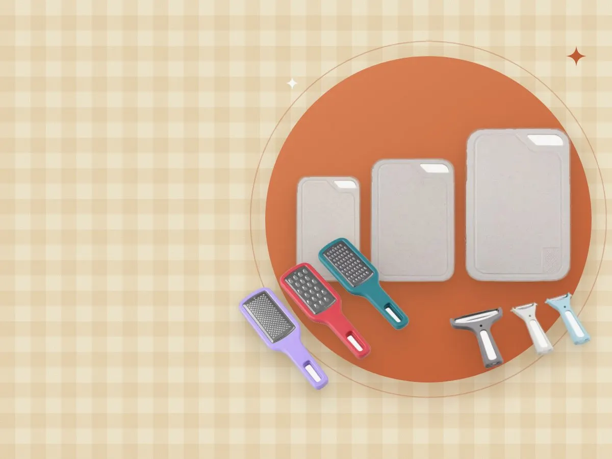 Cutting boards, handheld graters and vegetable peelers on a gingham background