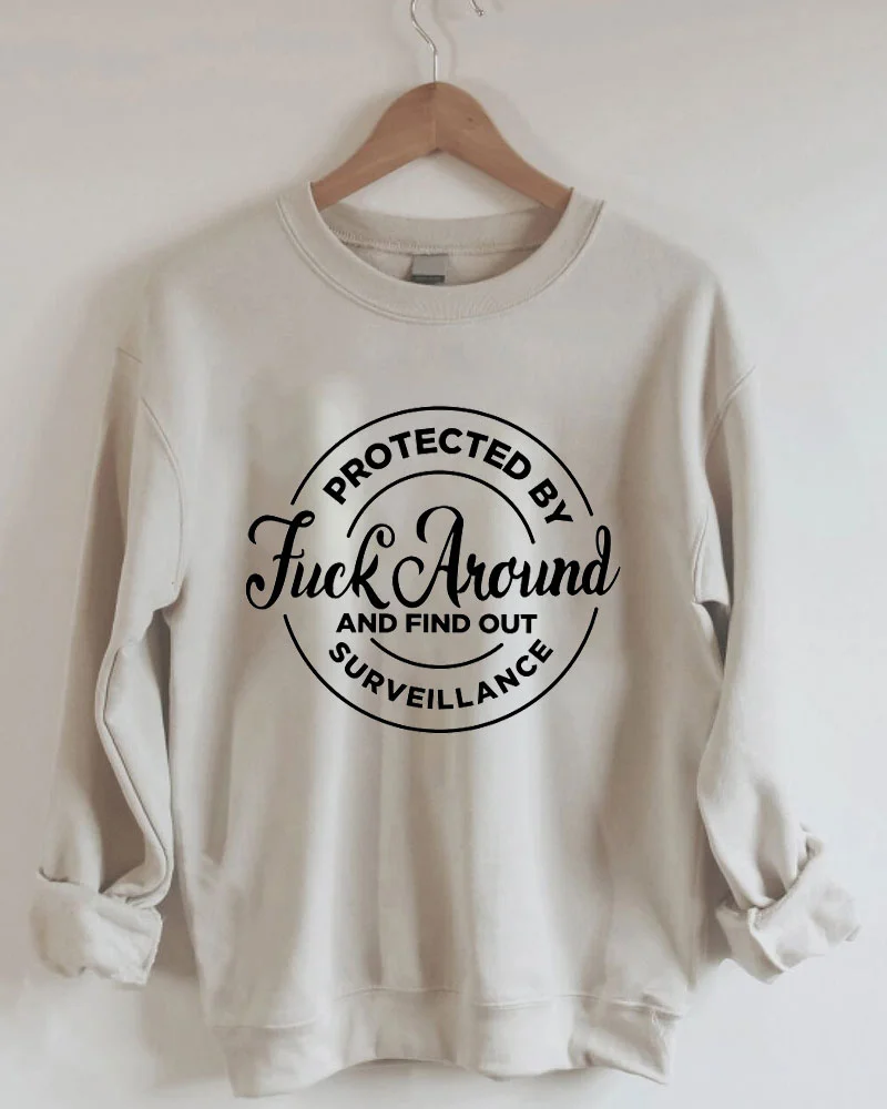 Protected by Fuck Around and Find Out Surveillance Sweatshirt