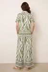 Back view of women's zebra print co-ord set showing relaxed fit and border print details