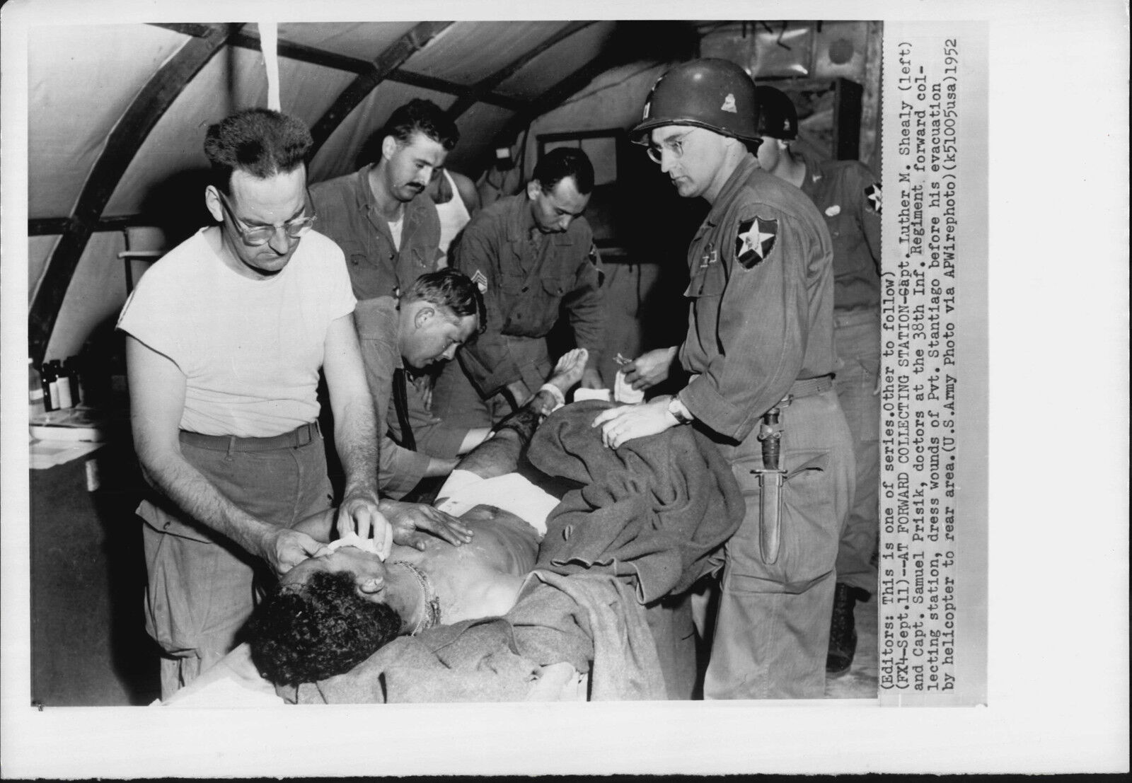 Wounded Treated by Doctors at Forward Aid Station 1952 Korea War Press Photo Poster painting