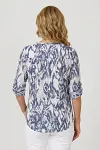Back view of breathable tie-dye inspired summer top with roll-tab sleeves