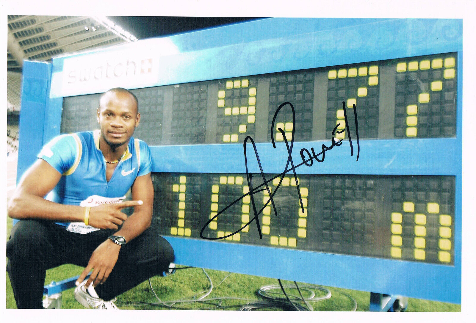 Asafa Powell 1982- genuine autograph 8x12