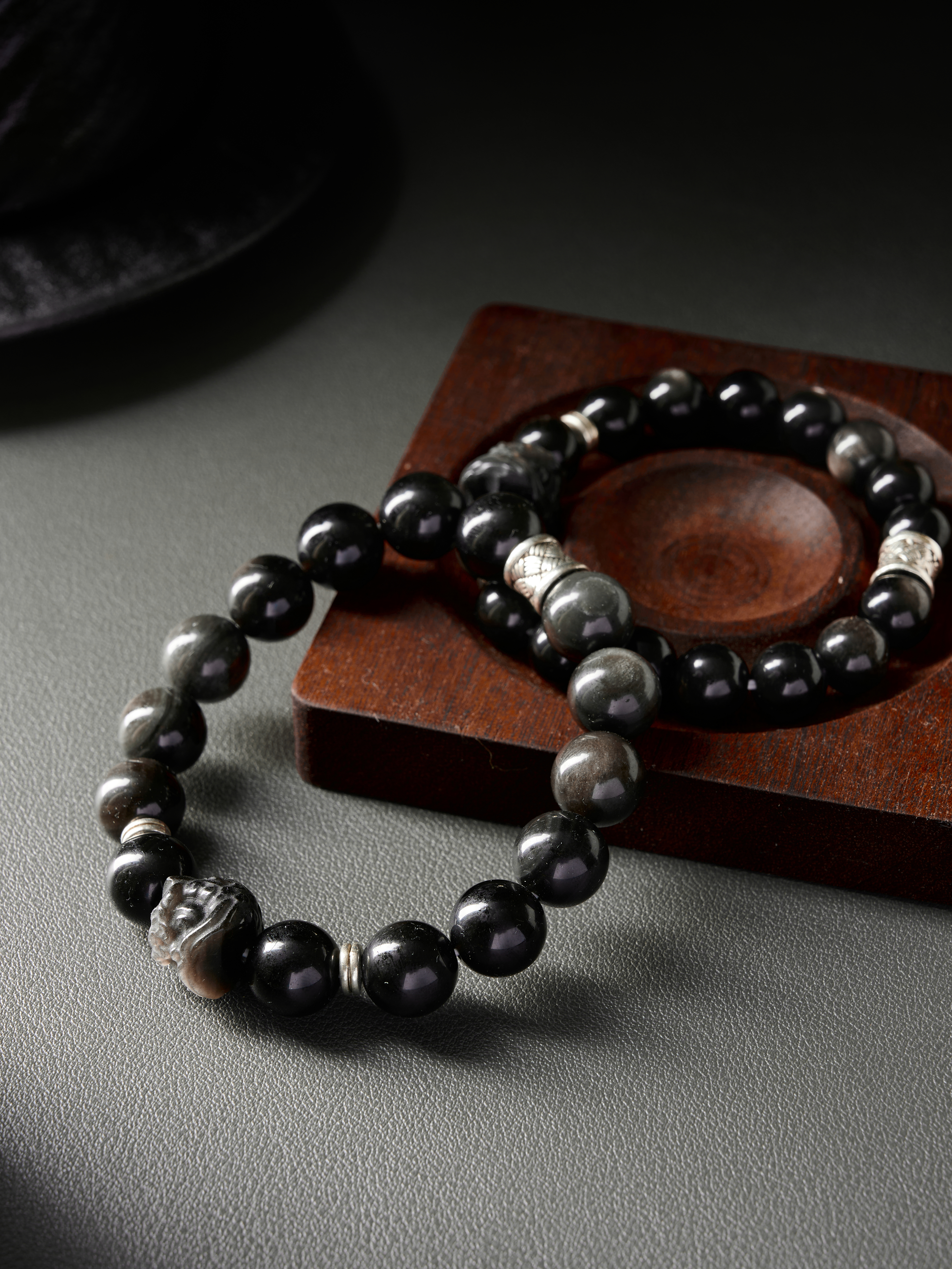 Overlapping pair in diagonal layout, even bead spacing and hidden elastic cord, unisex style
