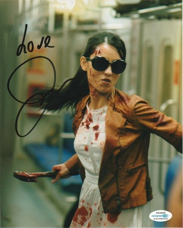 JULIE ESTELLE SIGNED THE RAID 2