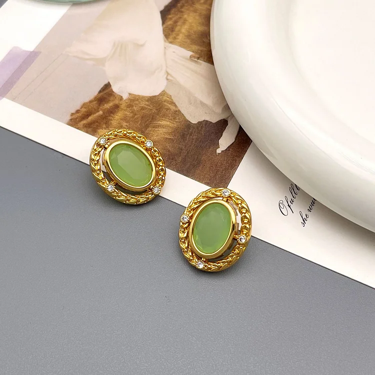 Elliptically inlaid jade colored glass minimalist earrings
