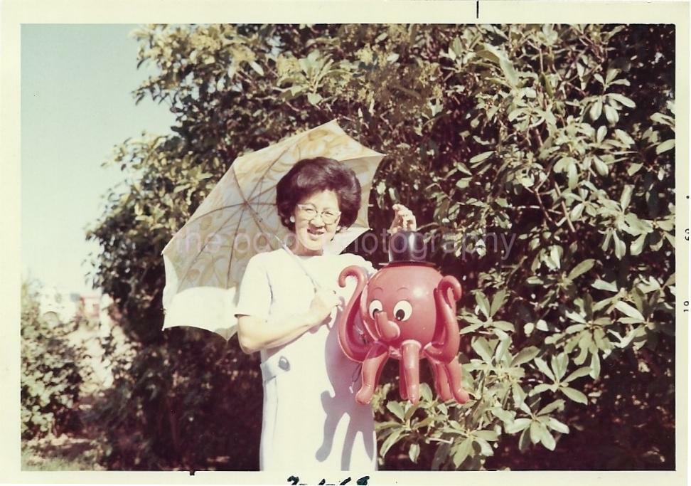 Umbrella Lady Holding A Blow Up Octopus FOUND VINTAGE Photo Poster paintingGRAPH Color 13 16 B