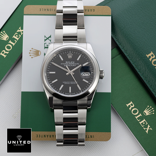 Rolex Datejust 115200 Black Dial Replica next to warranty card