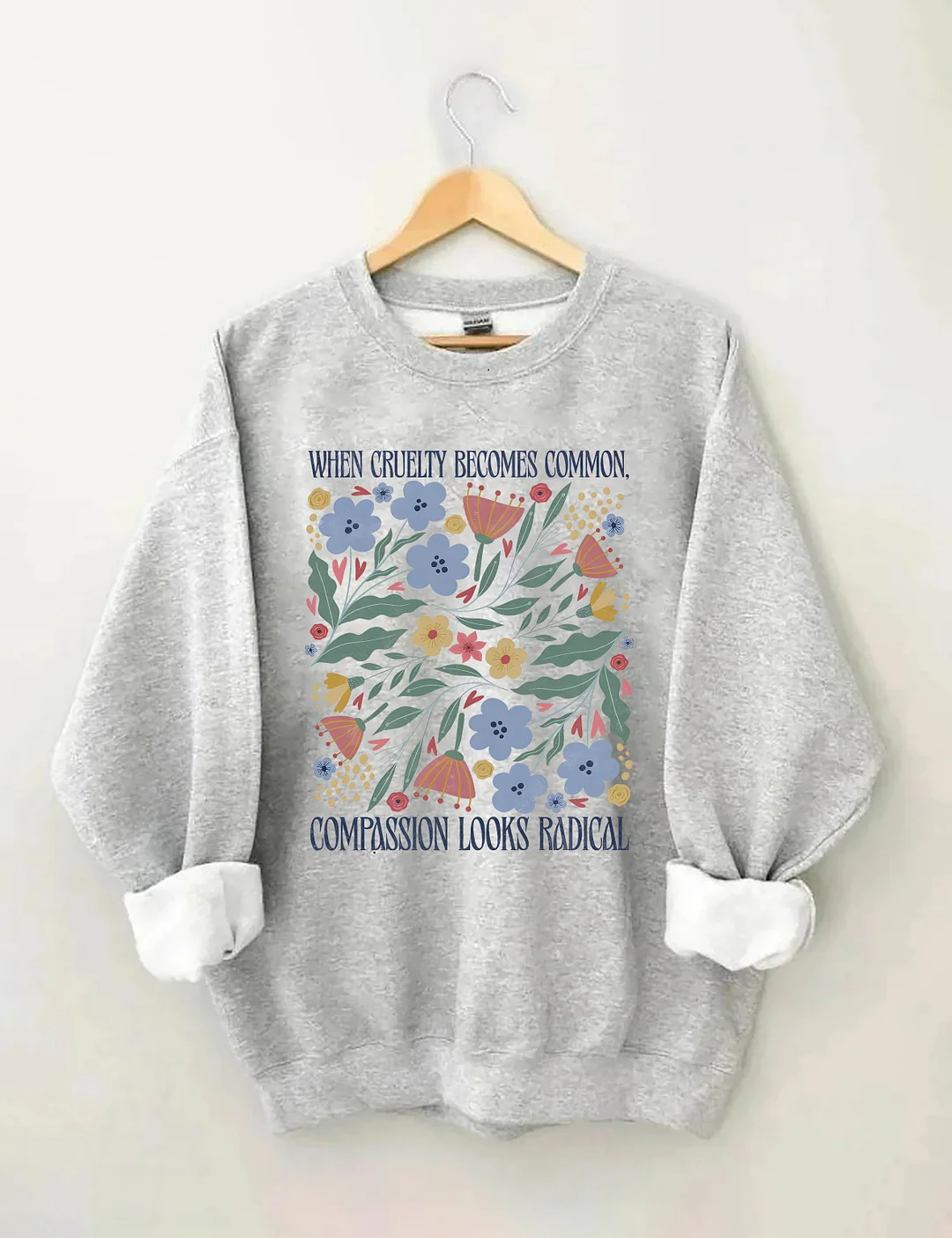 When Cruelty Becomes Common Compassion Looks Radical Sweatshirt