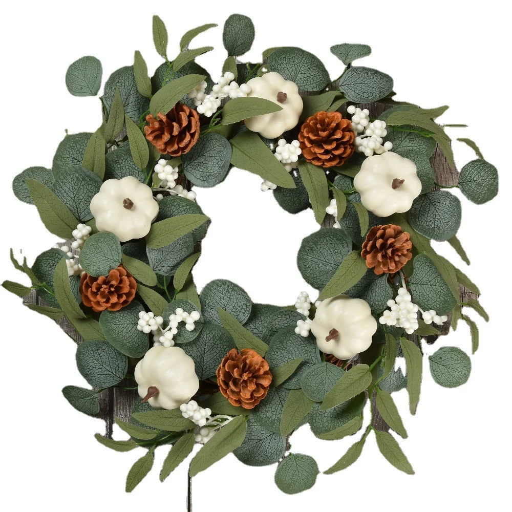White pumpkin wreath decoration with eucalyptus leaves