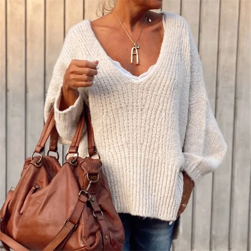 V-neck knitted sweater with side slits