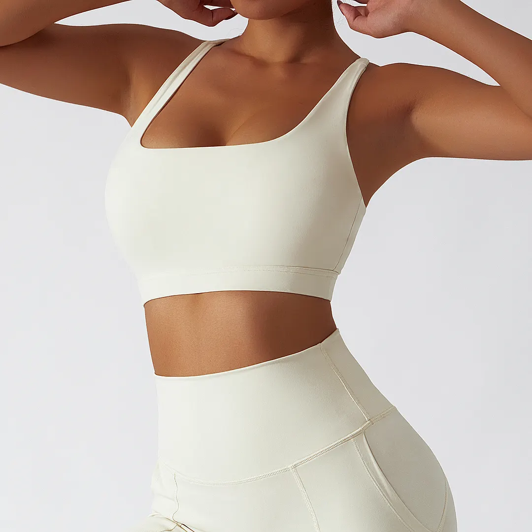 Hergymclothing Cream Apricot eco friendly sustainable recycled fabric high impact racer back sports bra for sale