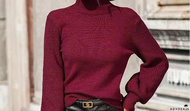Pullover women's knitted sweater with high collar and studded beads
