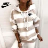 NOVO SU&Eacute;TER LISTRADO DE MANGA COMPRIDA "NIKE&reg;" 2023