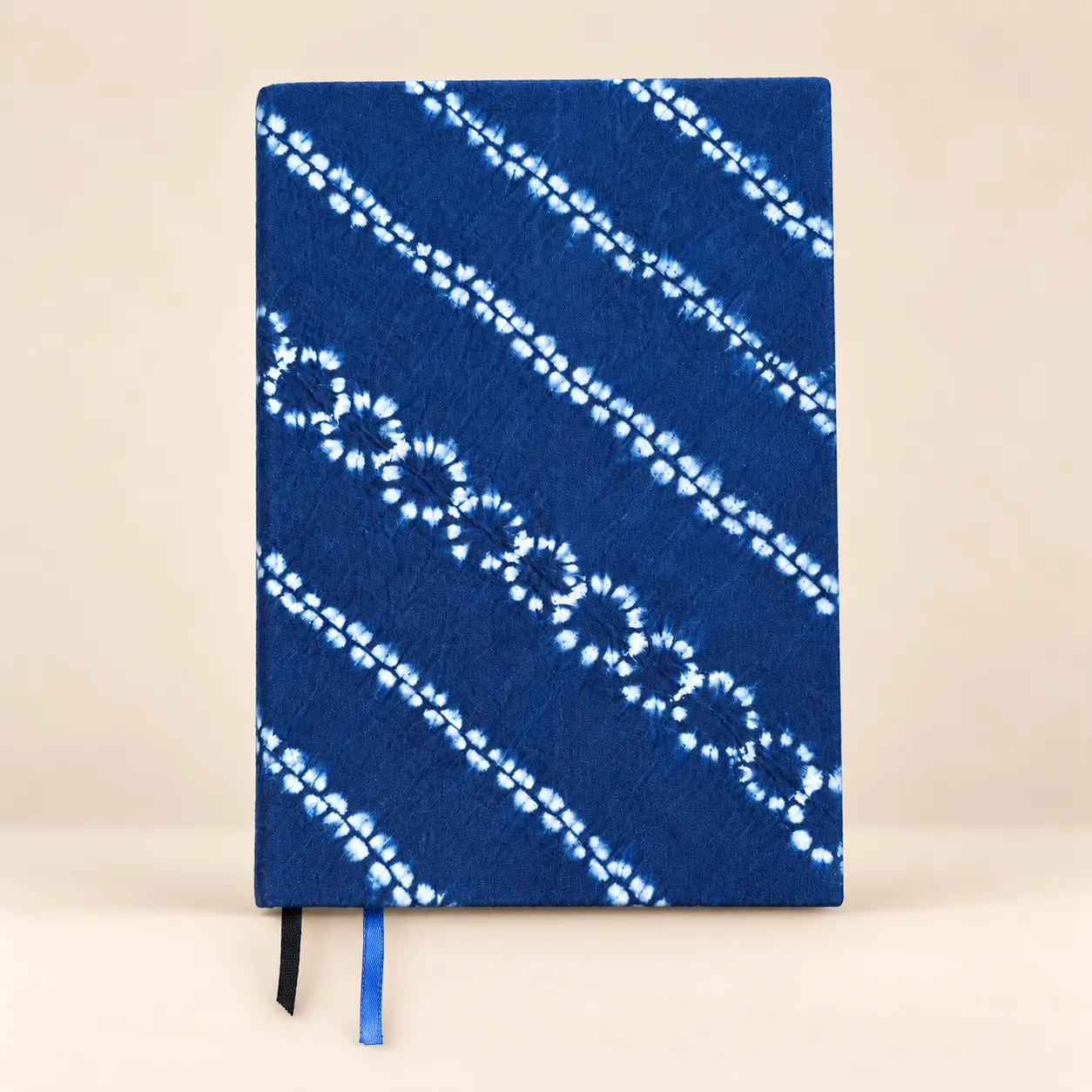 Indigo Trails A5 notebook with a blue cotton cover and white diagonal tie-dye patterns