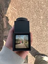 Handheld waist-level viewfinder composition trainer