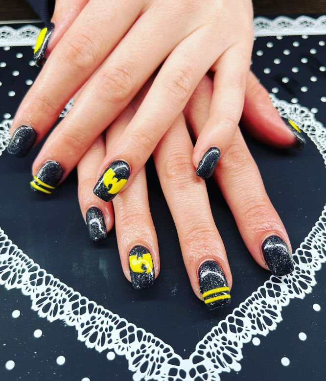Caviar Manicure In Yellow Black Nails With Black And Gold Rhinestones On A  Brilliant Background. Stock Photo, Picture and Royalty Free Image. Image  34646066.