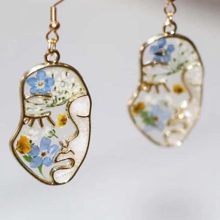 FREE Today: Forget-me-not Abstract Face Ebossed Earrings