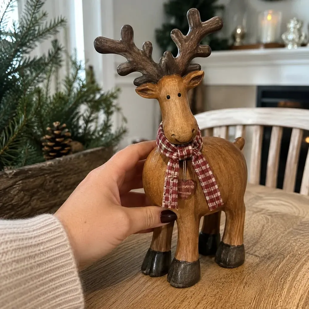Customer holding rustic reindeer figurine