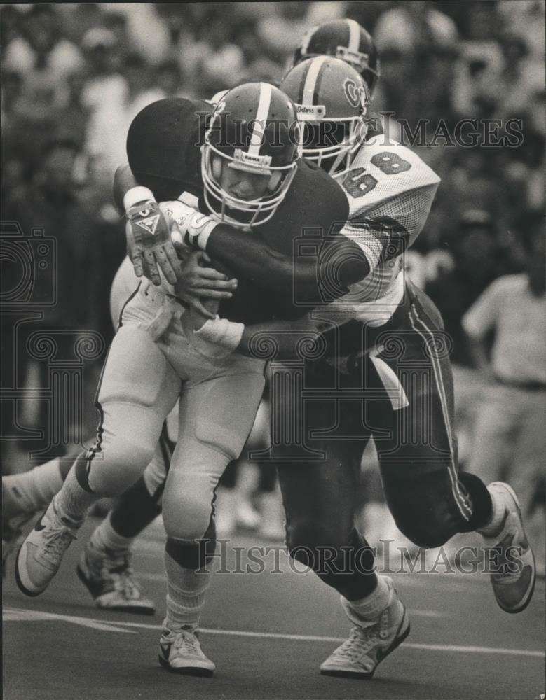 Press Photo Poster painting Alabama David Smith tackled by Florida #68 Rhondy Weston.