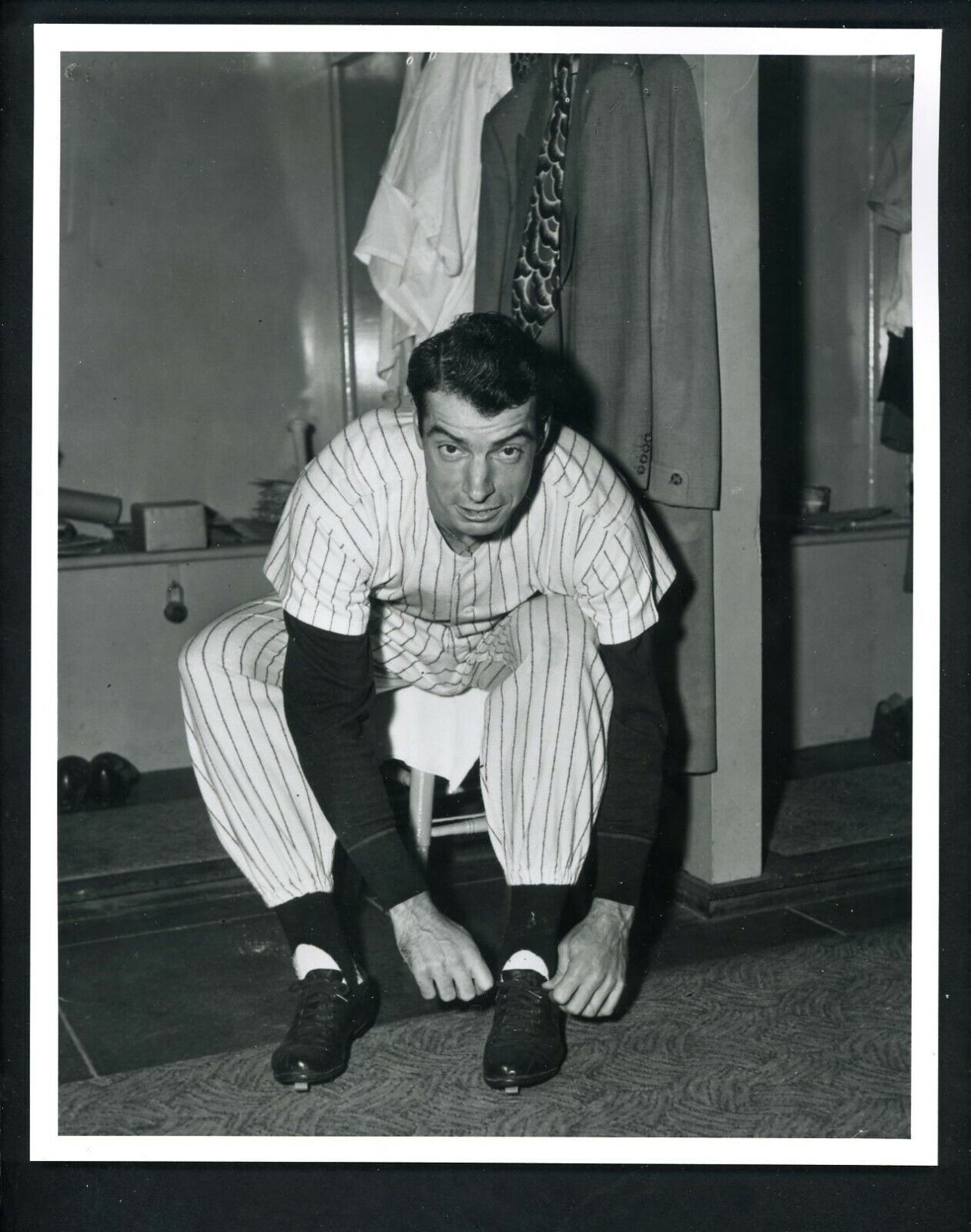 Joe DiMaggio ties his spikes circa 1940's Type IV Press Photo Poster painting New York Yankees