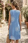 Back view of cornflower blue sleeveless linen blend dress with dandelion print