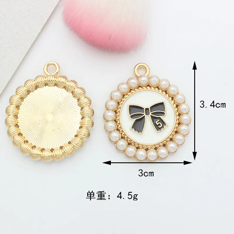 10 PCS/Package 1.5 * 20mm 14 * 14mm 7 * 12mm Alloy Rhinestones Pearl Number Heart Shape Bow Knot Polished Pendant