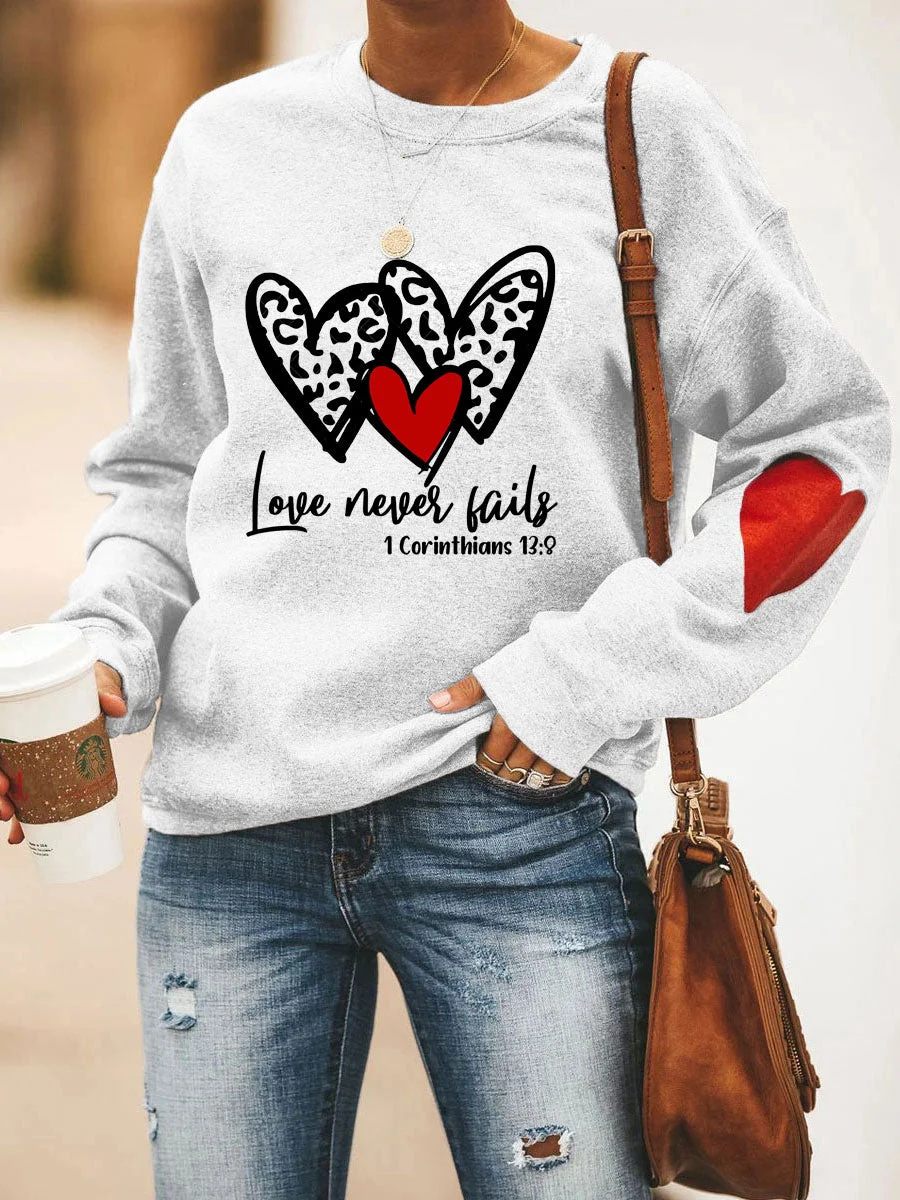 Love Never Fails Heart Sweatshirt