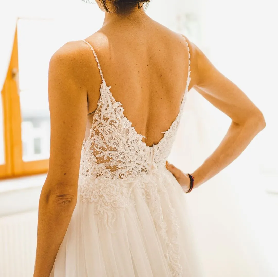 Sexy Long A-Line Spaghetti Strap Lace Backless Wedding Dresseswith Slit main image 1