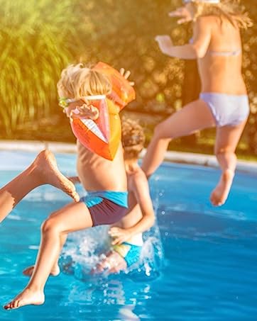 Kids jumping into above ground pool