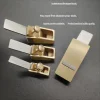 Musical instrument making and repair tools: Flat-bottomed thumb-sized copper plane, woodworking plane