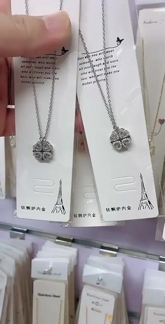 Folded four-leaf clover, zircon, gold-plated necklace.