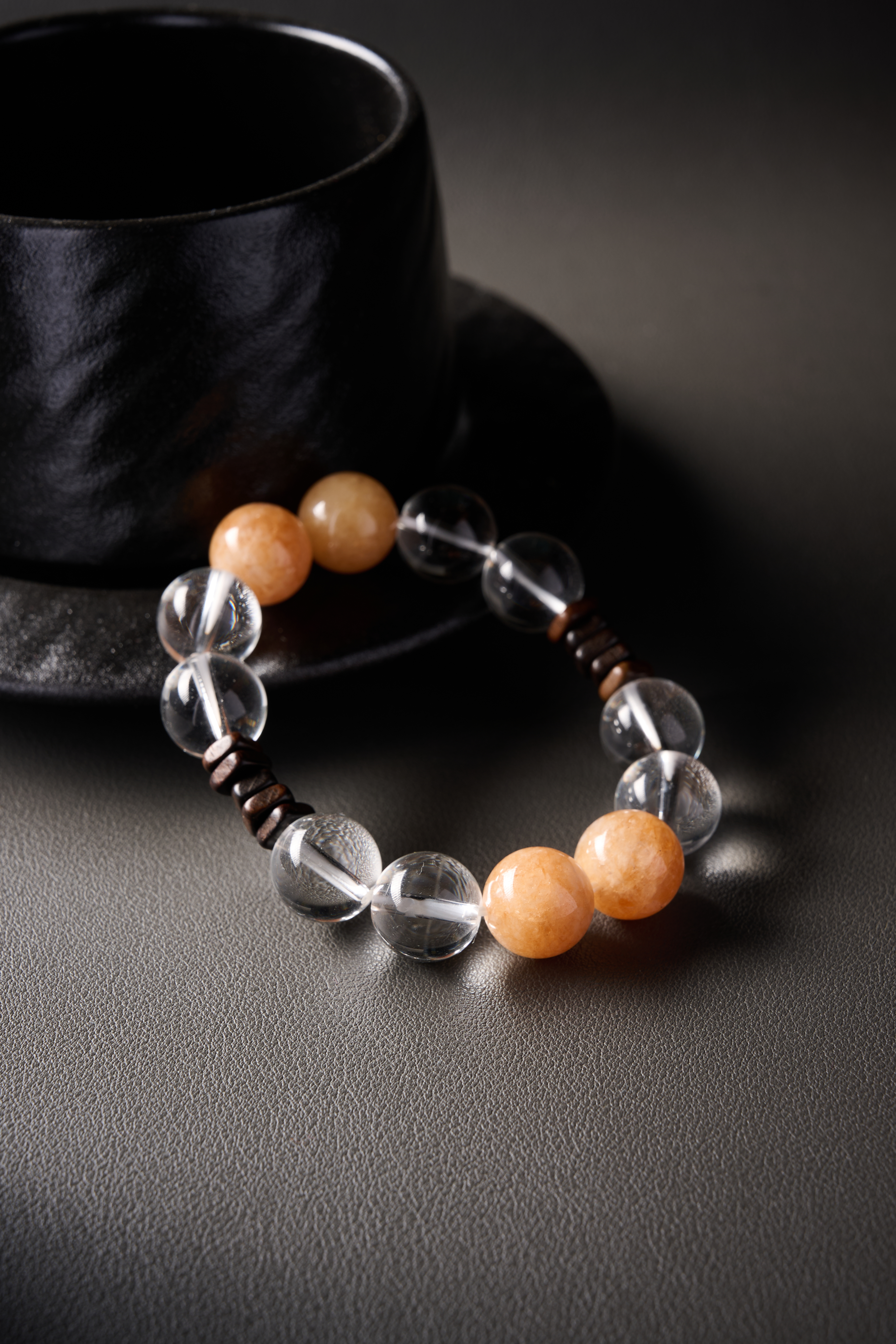 Detail – high-clarity clear quartz beads showing crisp transparency and inner reflections.