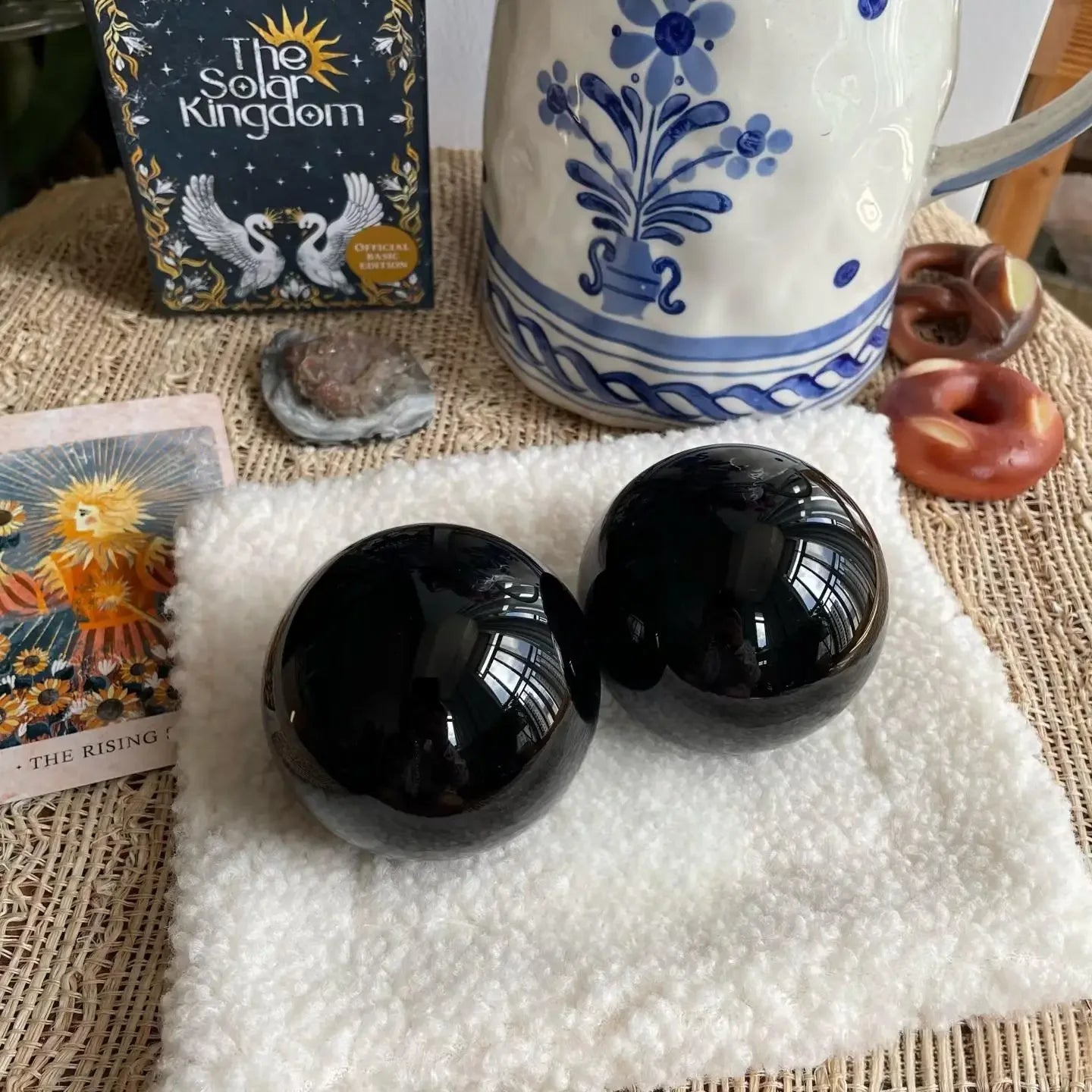 Black obsidian sphere styled in meditation or altar space