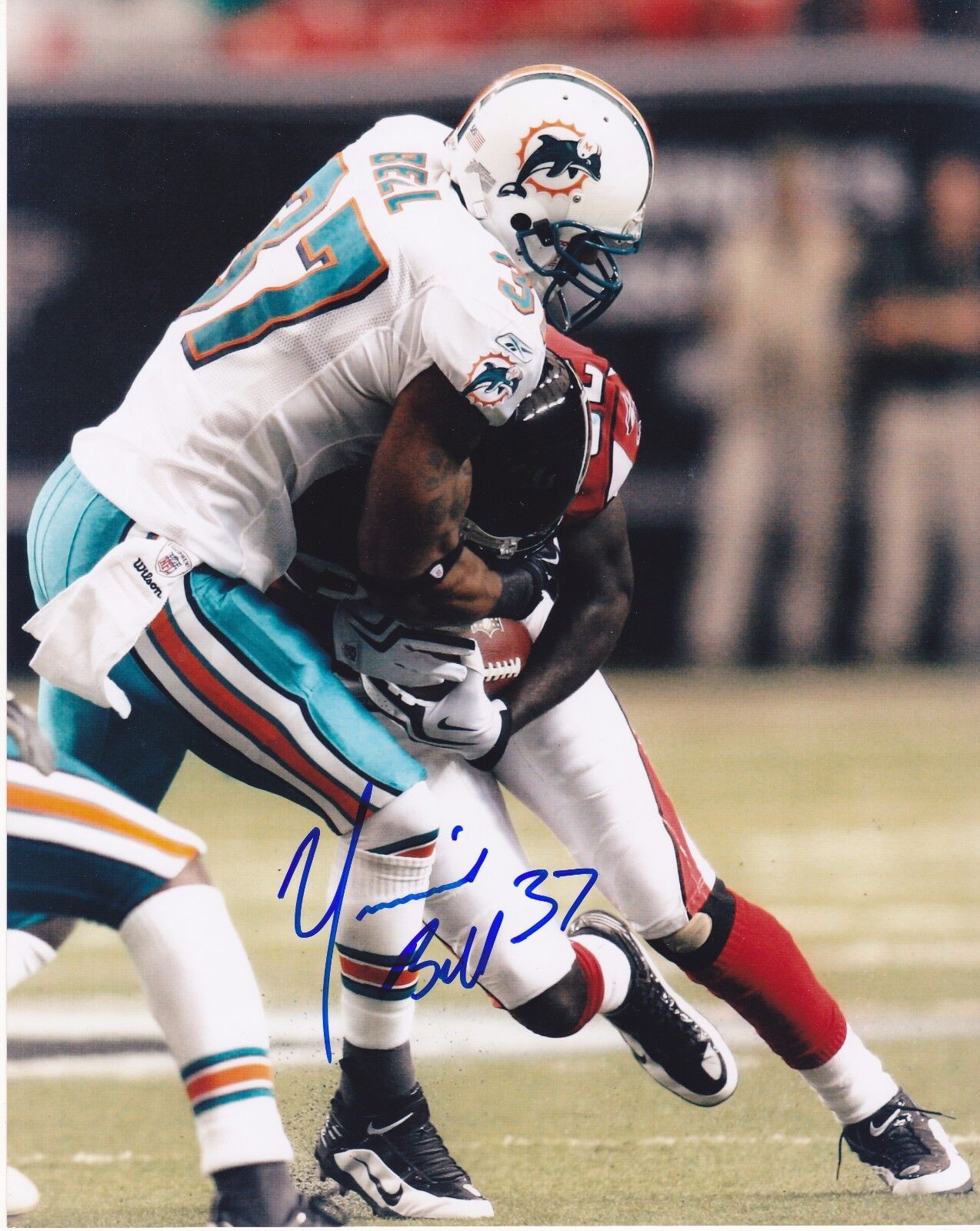 YEREMIAH BELL MIAMI DOLPHINS ACTION SIGNED 8x10