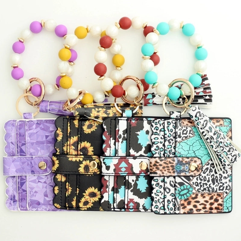 Casual Ethnic Style Sunflower Solid Color Leopard Pu Leather Beaded Tassel Keychain