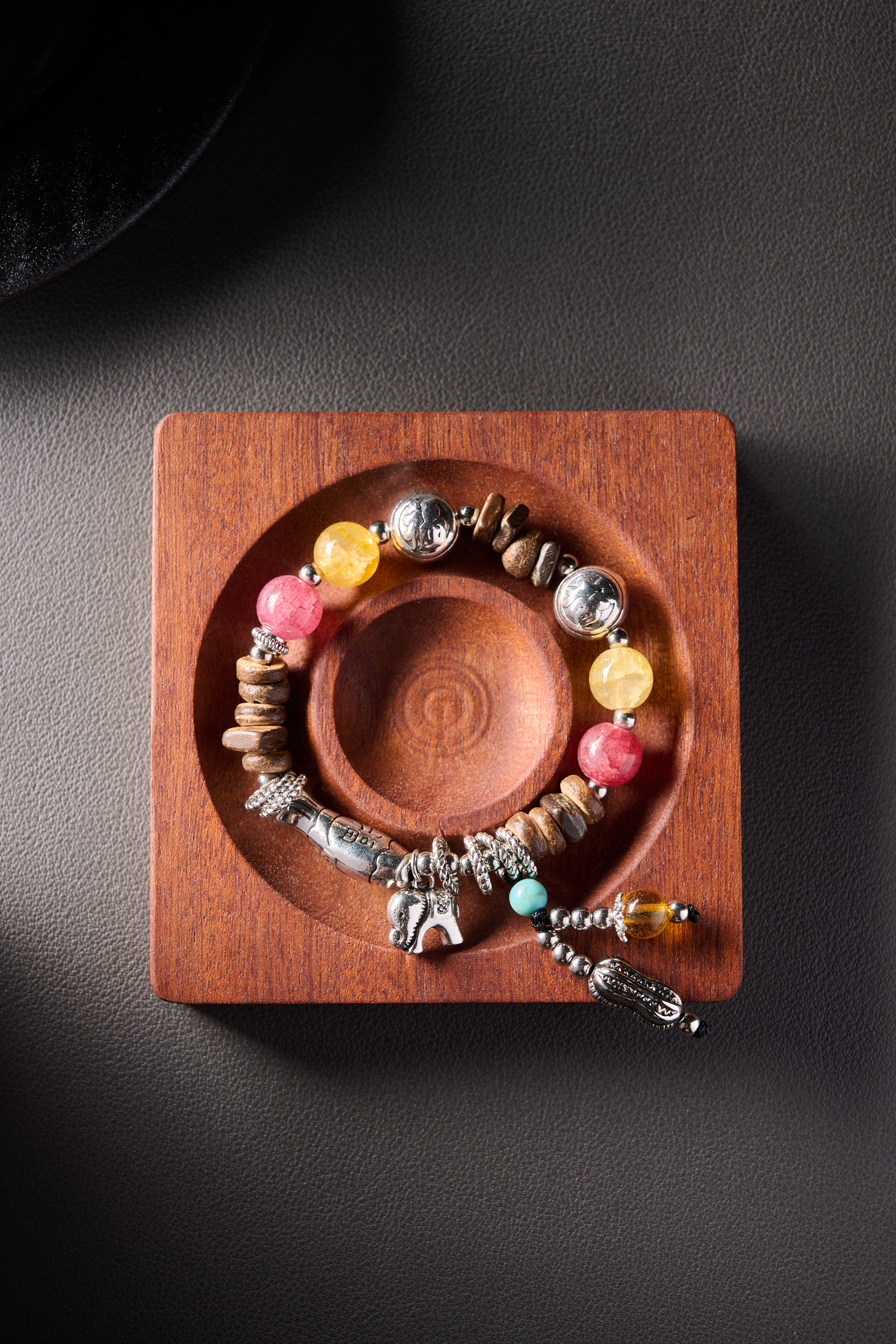 Spacer view – engraved silver-tone round beads with ethnic patterns, clean stringing.