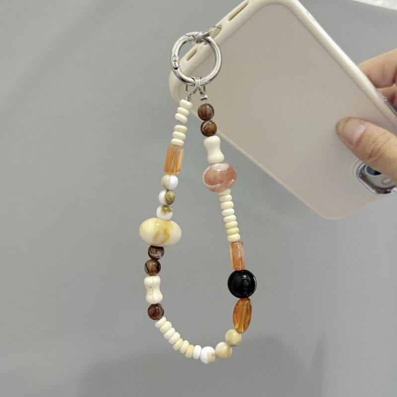 Handmade bead chain featuring natural oval amber beads, designed for use as a keychain, phone charm, or camera strap.