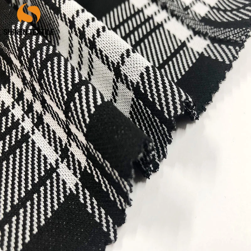Classic plaid black and white jacquard fabric.82%polyester+15%rayon+3%spandex.240G.Chinese factory.